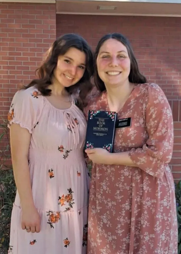 Sister Hartley with her painted Book of Mormon